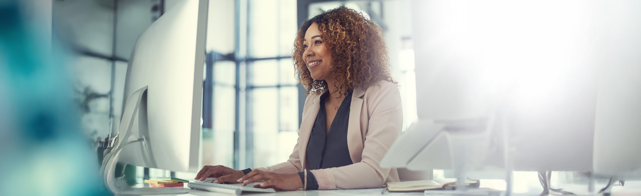 woman using her computer at desk